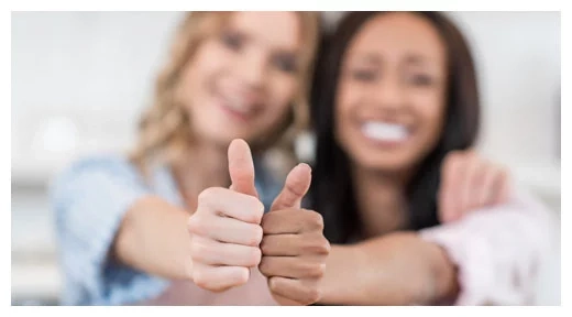 Two people giving a thumbs‑up gesture