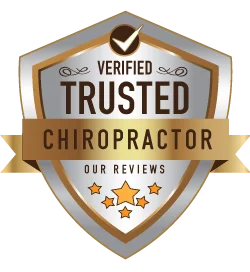 Gold and silver badge graphic labeled ‘Verified Trusted Chiropractor’